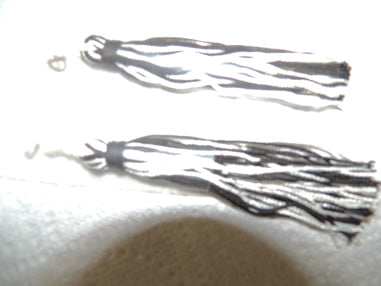 Pair of Tassels, Black/White Mix 506C - Past Pup Tent Seam Squirrels
